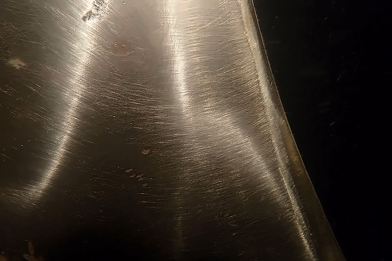 A ship's propeller blade underwater, polished bright